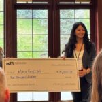 Mina Golazad receiving her scholarship